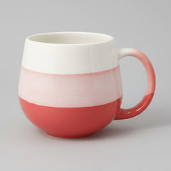 White mug with red accent on a white background